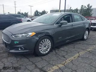 2016 Ford Fusion Energi SE Luxury with VIN 3FA6P0PU6GR165971, listed as a IAAI auction lot 41417233 with 118,240 mi miles. Bid and sale history available at carsss.com. Image 2.