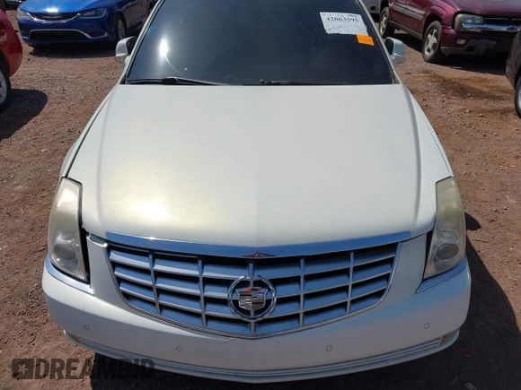 2006 Cadillac DTS w/1SC with VIN 1G6KD57Y36U116528, listed as a IAAI auction lot 42063595 with 128,839 mi miles. Bid and sale history available at carsss.com. Image 6.
