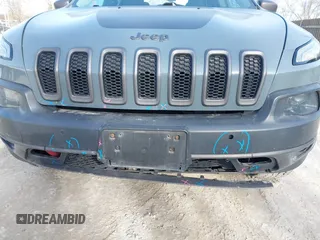 2014 Jeep Cherokee Trailhawk z VIN 1C4PJMBS5EW147579, wystawiony jako IAAI lot #41781543 z przebiegiem 155 751 mil mil oraz . Historia ofert i sprzedaży dostępna na DreamBid. Obrazek 21.
