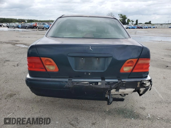 1997 Mercedes-Benz E-Class with VIN WDBJF55F4VJ025769, listed as a Copart auction lot 73460164 with 0 mi miles and Salvage Title. Bid and sale history available at carsss.com. Image 6.