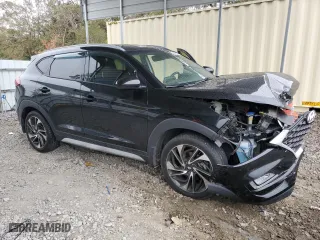 2020 Hyundai Tucson Sport with VIN KM8J33AL3LU238987, listed as a Copart auction lot 84007664 with 77,244 mi miles and Salvage Title. Bid and sale history available at carsss.com. Image 4.