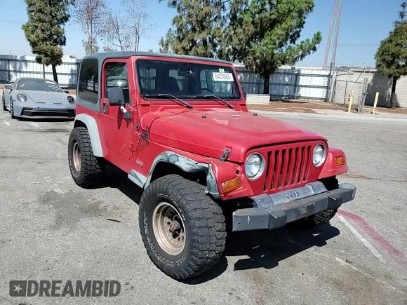 1999 Jeep Wrangler Sport with VIN 1J4FY19S7XP401120, listed as a Copart auction lot 64233665 with 129,708 mi miles and Salvage title. Bid and sale history available at DreamBid. Image 13.
