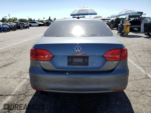 2014 Volkswagen Jetta SE with VIN 3VWD17AJ2EM322087, listed as a Copart auction lot 62571155 with 71,884 mi miles and Salvage title. Bid and sale history available at DreamBid. Image 6.