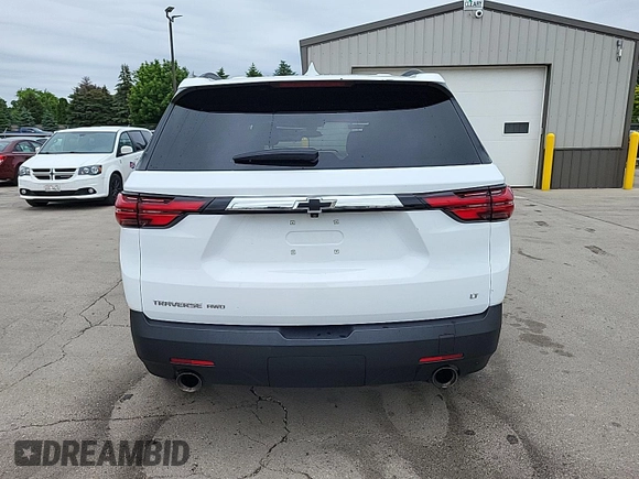 2023 Chevrolet Traverse LT z VIN 1GNEVHKW5PJ325679, wystawiony jako IAAI lot #42541394 z przebiegiem 74 480 mil mil oraz . Historia ofert i sprzedaży dostępna na DreamBid. Obrazek 5.