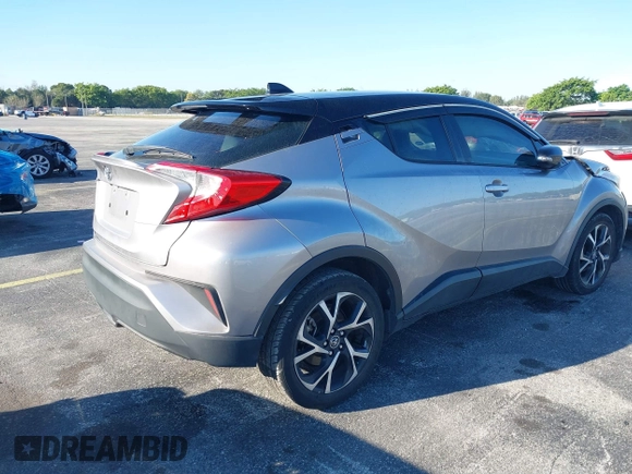2019 Toyota C-HR XLE with VIN NMTKHMBX4KR082574, listed as a IAAI auction lot 41694921 with 61,777 mi miles and . Bid and sale history available at DreamBid. Image 4.