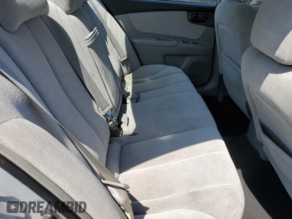 2008 Kia Optima LX z VIN KNAGE123185190108, wystawiony jako Copart lot #59364195 z przebiegiem 131 344 mil mil oraz Szkoda całkowita • Salvage title. Historia ofert i sprzedaży dostępna na DreamBid. Obrazek 10.