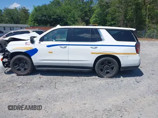 2022 Chevrolet Tahoe Commercial z VIN 1GNSCLED4NR222340, wystawiony jako IAAI lot #42321388 z przebiegiem Nie podano mil oraz . Historia ofert i sprzedaży dostępna na DreamBid. Obrazek 14.