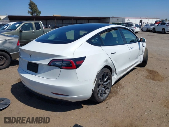 2023 Tesla Model 3 with VIN 5YJ3E1EA2PF571569, listed as a IAAI auction lot 42288715 with 30,271 mi miles and . Bid and sale history available at DreamBid. Image 4.