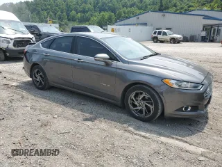 2014 Ford Fusion SE Hybrid with VIN 3FA6P0LU9ER289817, listed as a Copart auction lot 60909615 with 168,884 mi miles and Salvage title. Bid and sale history available at DreamBid. Image 4.