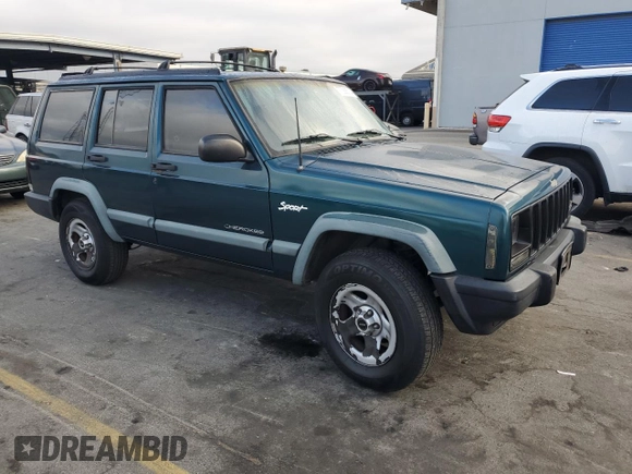 1998 Jeep Cherokee Sport with VIN 1J4FT68S2WL236774, listed as a Copart auction lot 77388734 with 128,591 mi miles and Clean Title. Bid and sale history available at carsss.com. Image 4.