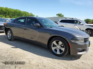 2015 Dodge Charger SXT with VIN 2C3CDXHG8FH794623, listed as a Copart auction lot 52000144 with 145,624 mi miles and Salvage Title. Bid and sale history available at DreamBid. Image 4.