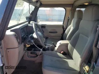 2003 Jeep Wrangler Sahara z VIN 1J4FA59SX3P302622, wystawiony jako Copart lot #52756105 z przebiegiem 181 900 mil mil oraz Szkoda całkowita • Salvage title. Historia ofert i sprzedaży dostępna na DreamBid. Obrazek 7.