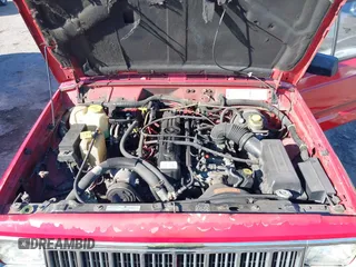 1996 Jeep Cherokee SE with VIN 1J4FT28S0TL225891, listed as a IAAI auction lot 41411705 with 233,983 mi miles and . Bid and sale history available at DreamBid. Image 10.