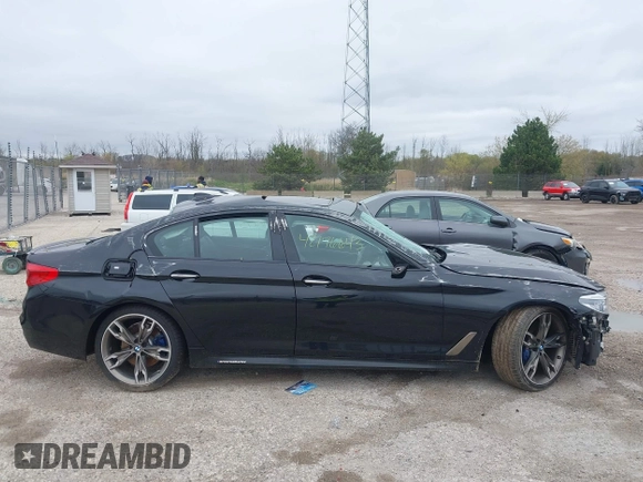 2018 BMW 5 Series M550i xDrive with VIN WBAJB9C56JB286742, listed as a IAAI auction lot 42176643 with 61,445 mi miles and . Bid and sale history available at DreamBid. Image 14.