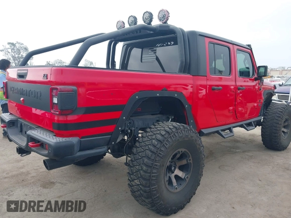 2020 Jeep Gladiator Rubicon with VIN 1C6JJTBG4LL178260, listed as a IAAI auction lot 42602460 with 61,899 mi miles and . Bid and sale history available at DreamBid. Image 4.