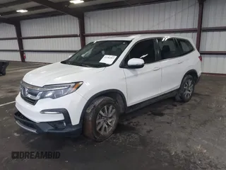 2021 Honda Pilot EX-L with VIN 5FNYF5H57MB022843, listed as a IAAI auction lot 41186957 with 57,836 mi miles. Bid and sale history available at carsss.com. Image 2.