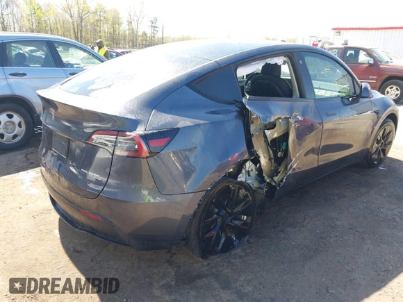 2022 Tesla Model Y Long Range z VIN 7SAYGAEE9NF574634, wystawiony jako IAAI lot #42040719 z przebiegiem 29 675 mil mil oraz . Historia ofert i sprzedaży dostępna na DreamBid. Obrazek 4.
