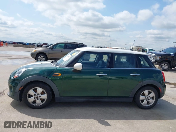 2016 MINI Hardtop 4 Door with VIN WMWXU1C52G2D10035, listed as a IAAI auction lot 42190544 with 106,383 mi miles and . Bid and sale history available at DreamBid. Image 14.