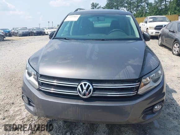 2014 Volkswagen Tiguan SE z VIN WVGAV3AX0EW576108, wystawiony jako IAAI lot #42405804 z przebiegiem 117 530 mil mil oraz . Historia ofert i sprzedaży dostępna na DreamBid. Obrazek 12.