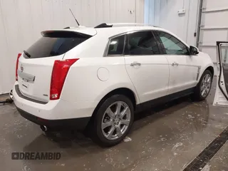 2012 Cadillac SRX Premium Collection z VIN 3GYFNFE38CS591123, wystawiony jako IAAI lot #41827636 z przebiegiem 143 867 mil mil oraz . Historia ofert i sprzedaży dostępna na DreamBid. Obrazek 4.