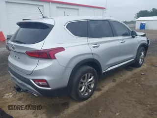 2019 Hyundai Santa Fe SE z VIN 5NMS23AD4KH130517, wystawiony jako IAAI lot #42324854 z przebiegiem 76 963 mil mil oraz . Historia ofert i sprzedaży dostępna na DreamBid. Obrazek 4.
