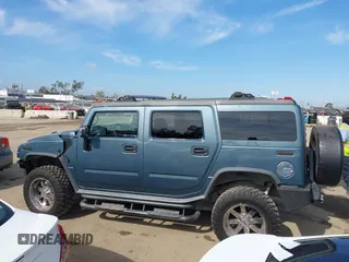 2005 Hummer H2 SUV with VIN 5GRGN23U35H105620, listed as a IAAI auction lot 41912574 with 232,938 mi miles. Bid and sale history available at carsss.com. Image 15.