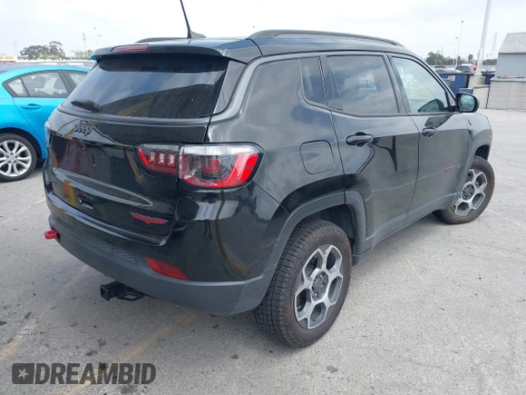 2022 Jeep Compass Trailhawk with VIN 3C4NJDDB8NT107992, listed as a IAAI auction lot 42116531 with 48,787 mi miles and . Bid and sale history available at DreamBid. Image 4.