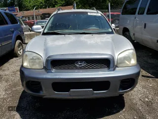 2004 Hyundai Santa Fe z VIN KM8SB12B14U711904, wystawiony jako Copart lot #58957365 z przebiegiem 214 051 mil mil oraz Szkoda całkowita • Salvage title. Historia ofert i sprzedaży dostępna na DreamBid. Obrazek 5.