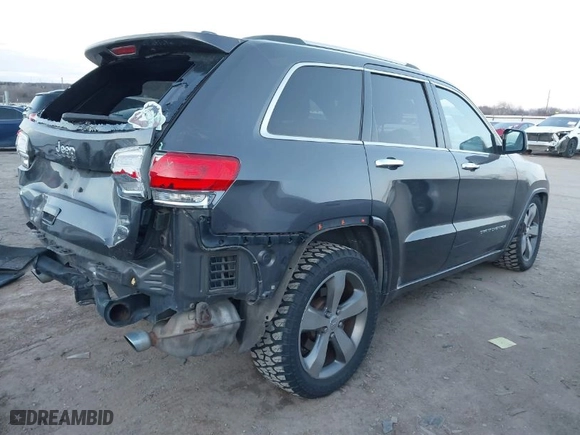 2014 Jeep Grand Cherokee Overland with VIN 1C4RJFCT8EC380899, listed as a IAAI auction lot 41372034 with 140,413 mi miles. Bid and sale history available at carsss.com. Image 4.