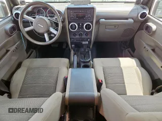 2008 Jeep Wrangler Unlimited Sahara with VIN 1J4GA59148L608970, listed as a Copart auction lot 64433495 with 134,055 mi miles and Salvage title. Bid and sale history available at DreamBid. Image 8.
