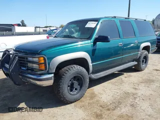 1999 GMC Suburban with VIN 3GKGK26J4XG508566, listed as a IAAI auction lot 41778760 with 1,028,244 mi miles. Bid and sale history available at carsss.com. Image 2.