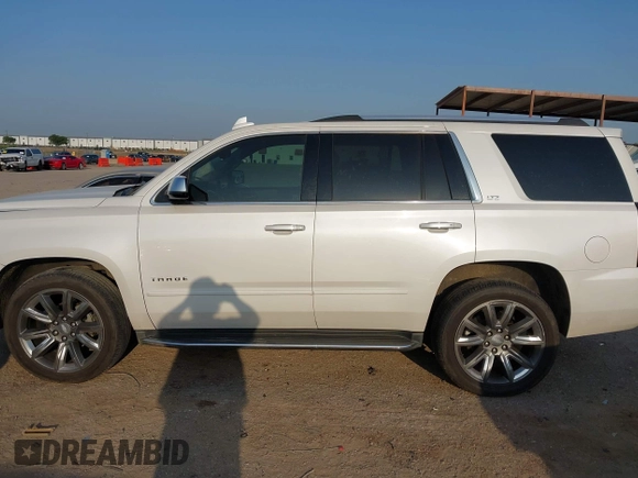 2016 Chevrolet Tahoe LTZ with VIN 1GNSKCKC9GR243895, listed as a IAAI auction lot 42322779 with 162,138 mi miles and . Bid and sale history available at DreamBid. Image 14.