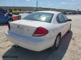 2006 Ford Taurus SE with VIN 1FAHP532X6A257510, listed as a IAAI auction lot 41892422 with 130,633 mi miles. Bid and sale history available at carsss.com. Image 4.