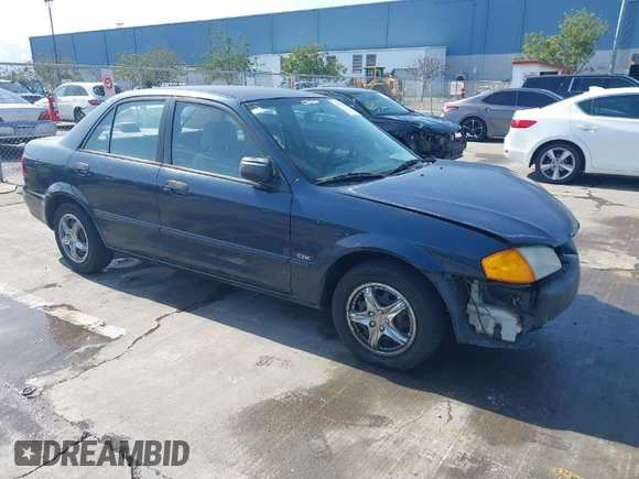 1999 Mazda Protege DX z VIN JM1BJ2229X0189290, wystawiony jako IAAI lot #41796448 z przebiegiem 281 528 mil mil oraz . Historia ofert i sprzedaży dostępna na DreamBid. Obrazek 1.