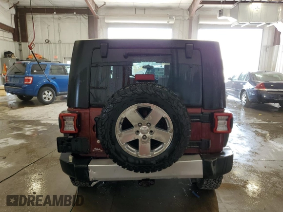2008 Jeep Wrangler Unlimited Sahara z VIN 1J4GA59198L570409, wystawiony jako Copart lot #58853295 z przebiegiem 84 502 mil mil oraz Nie do naprawy • Non repairable. Historia ofert i sprzedaży dostępna na DreamBid. Obrazek 6.