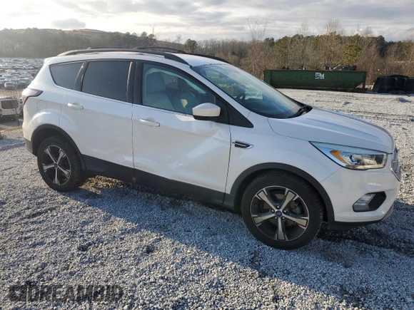 2017 Ford Escape SE with VIN 1FMCU0GD6HUB48986, listed as a Copart auction lot 43915415 with 122,465 mi miles and Salvage Title. Bid and sale history available at DreamBid. Image 4.