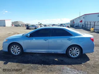 2014 Toyota Camry Hybrid LE with VIN 4T1BD1FK7EU098824, listed as a IAAI auction lot 42063119 with 112,759 mi miles. Bid and sale history available at carsss.com. Image 14.