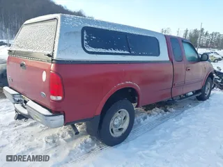 2000 Ford F-150 XL with VIN 1FTRX18WXYNC06121, listed as a IAAI auction lot 41340585 with 74,957 mi miles. Bid and sale history available at carsss.com. Image 4.