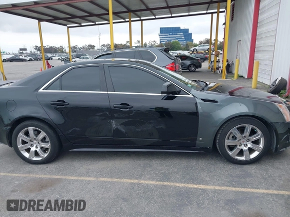 2011 Cadillac CTS Luxury with VIN 1G6DF5EYXB0103430, listed as a IAAI auction lot 42105337 with 205,069 mi miles and . Bid and sale history available at DreamBid. Image 6.