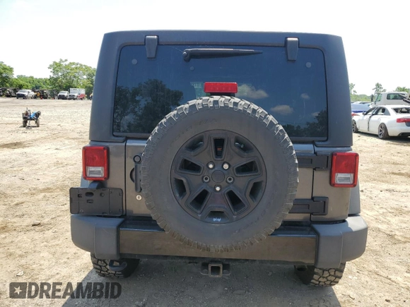 2014 Jeep Wrangler Unlimited Sport with VIN 1C4BJWDG1EL298161, listed as a Copart auction lot 61996735 with 176,043 mi miles and Salvage title. Bid and sale history available at DreamBid. Image 6.