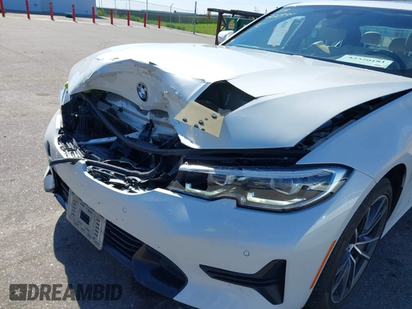 2021 BMW 3 Series 330i xDrive with VIN WBA5R7C0XMFK54525, listed as a IAAI auction lot 42320181 with 54,576 mi miles and . Bid and sale history available at DreamBid. Image 6.