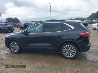 2021 Ford Escape Titanium Hybrid z VIN 1FMCU0DZ0MUA16798, wystawiony jako IAAI lot #42502086 z przebiegiem 107 250 mil mil oraz . Historia ofert i sprzedaży dostępna na DreamBid. Obrazek 14.