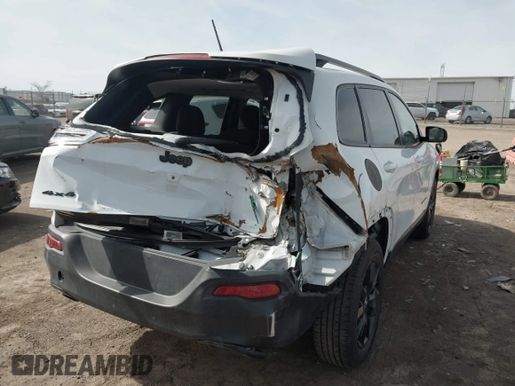 2014 Jeep Cherokee Latitude with VIN 1C4PJMCB1EW301011, listed as a IAAI auction lot 41777745 with 133,643 mi miles and . Bid and sale history available at DreamBid. Image 4.