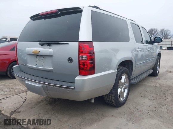 2013 Chevrolet Suburban LTZ with VIN 1GNSCKE02DR369777, listed as a IAAI auction lot 41565371 with 205,768 mi miles and . Bid and sale history available at DreamBid. Image 4.