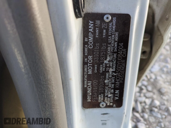 2000 Hyundai Accent z VIN KMHCG45G0YU084004, wystawiony jako Copart lot #42980585 z przebiegiem 167 545 mil mil oraz Czysty tytuł • Clean title. Historia ofert i sprzedaży dostępna na DreamBid. Obrazek 12.