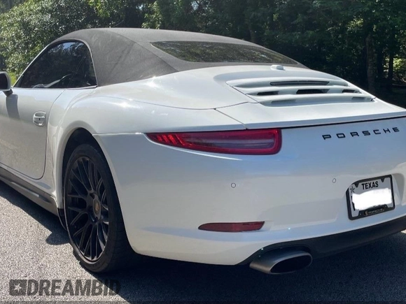 2014 Porsche 911 Carrera z VIN WP0CA2A92ES140453, wystawiony jako IAAI lot #42302853 z przebiegiem 47 879 mil mil oraz . Historia ofert i sprzedaży dostępna na DreamBid. Obrazek 3.