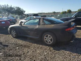 1999 Mitsubishi 3000GT z VIN JA3AM44HXXY002638, wystawiony jako Copart lot #67132454 z przebiegiem 181 684 mil mil oraz Tytuł czysty. Historia ofert i sprzedaży dostępna na DreamBid. Obrazek 2.