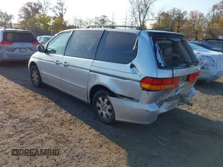 2004 Honda Odyssey EX-L with VIN 5FNRL18964B025323, listed as a IAAI auction lot 40714457 with 164,786 mi miles and . Bid and sale history available at DreamBid. Image 3.
