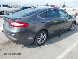 2016 Ford Fusion Titanium with VIN 3FA6P0SU9GR145186, listed as a IAAI auction lot 42023484 with 84,399 mi miles and . Bid and sale history available at DreamBid. Image 4.
