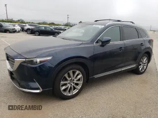 2017 Mazda CX-9 Grand Touring z VIN JM3TCADY3H0140573, wystawiony jako Copart lot #60513145 z przebiegiem 97 793 mil mil oraz Czysty tytuł • Clean title. Historia ofert i sprzedaży dostępna na DreamBid. Obrazek 1.